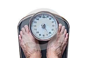 Close-up feet standing on weighing scale, isolated on white back