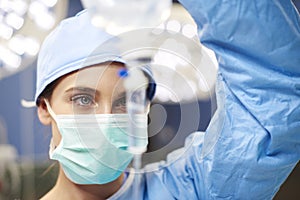 Female anesthesiologist during hard operation photo
