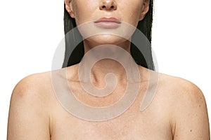 Close-up female body with first age-related changes  on white background. Cosmetics, spa, skin care and beauty