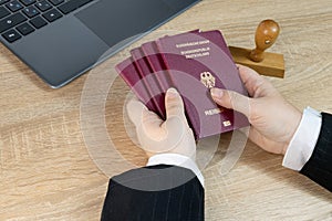 Close-up female border patrol officers meticulously inspecting foreign passports, Border Security and Control, Passport and Visa