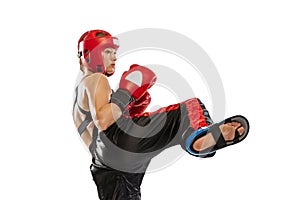 Close-up female boxer in boxing gloves and helmet training isolated on white studio background. Sport, competition