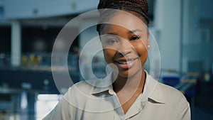 Close up female business portrait in office headshot portrait African American smiling businesswoman professional happy