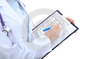 Close up of a female doctor filling up medical history form, just hands