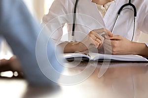 Close up of female doctor have consultation with patient