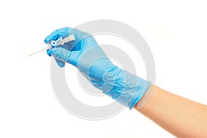 Close up of female doctor's hand in blue sterilized surgical glove with blue plastic catheter against white