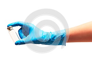 Close up of female doctor's hand in blue sterilized surgical glove holding empty transparent white glass ampoule