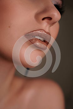 Close up of a female face - lips. Beauty portrait with professional makeup