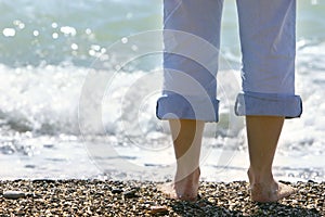 Close up of female feet on beach