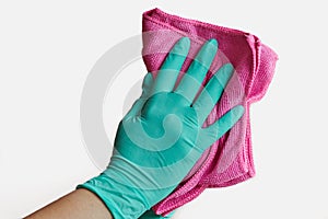 Close-up of female hand with glove and microfiber cloth cleaning isolated on white