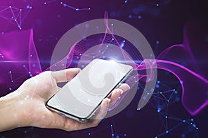 Close up of female hand holding white mock up cellphone with creative glowing purple metaverse space background. Abstract world