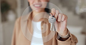 Close up female hand showing to camera bunch of keys