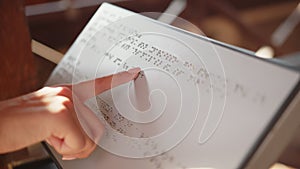 Close up of female hand touching ancient script