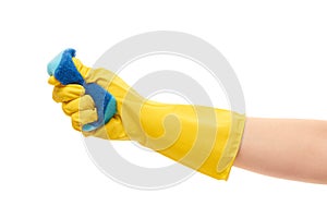 Close up of female hand in yellow protective rubber glove squeezing blue cleaning sponge