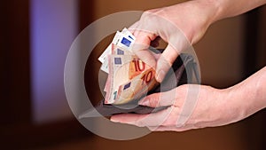 close-up of female hands counting euro bills in a wallet. salary concept