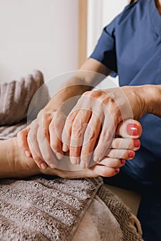 Close-up of female hands doing foot massage