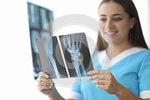 Surgeon looking at x-ray photo