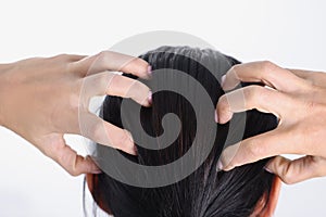 Close-up of female hands massaging her head