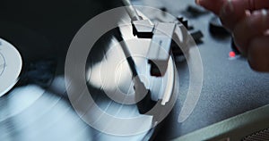 Close Up of Female Hands Operating a Vinyl Record Player