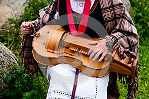 close-up of female hands playing lute