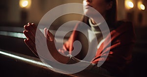 Close Up of Female Hands in Prayer Position in Church, Expressing Humility and Faith in God, Seeking