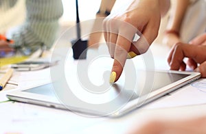 Close-up of female hands touching digital tablet