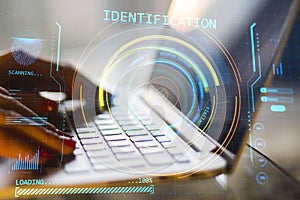 female hands using laptop with abstract round identification interface on blurry background. Forensic hud and scanner