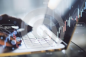 Close up of female hands using laptop with glowing forex chart on blurry background. Trade, finance and money concept. Double