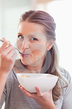Close up of female having cereals for breakfast