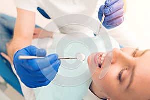 Close up of female patient treating her teeth at dentist