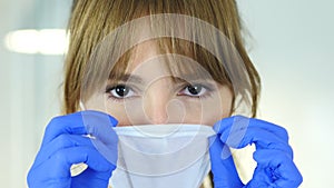 Close up of female reseach scientist, doctor wearing mask