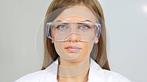 Close Up of Female Reseach Scientist, Doctor Wearing Protective Glasses