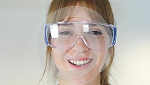 Close Up of Female Reseach Scientist, Doctor Wearing Protective Glasses