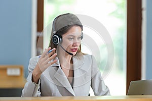 Close up female smiling wear headset operator worker call center hotline. woman working customer support service operator.