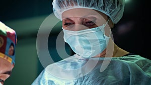 Close up of a female surgeon`s eye. Portrait of surgeon woman during surgery.