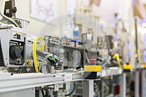 Close up fiber optic cable connection with programmable logic controller plc at high performance automatic manufacturing assembly