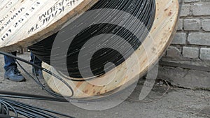 Close-up. fiber optic cable on a large wooden spool.