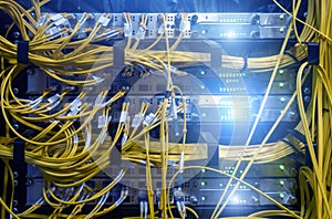 Close up fiber optic cable. Servers racks. Severs computer in a rack at the large data center