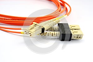 Close up of a fiber optic patchcord head over white background photo