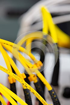 Close up fiber optic in server room , network cables installed in the rack Abstract image for use as a background