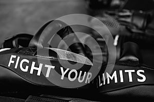 Close up of FIGHT YOUR LIMITS word on black boxing and kicking practice pad. Motivational and inspirational quote