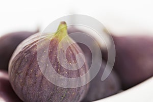 Close up of figs on white background.