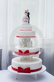 Close-up of figurine couple on wedding cake at the park