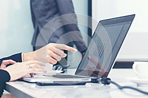 Close up finger businessman pointing financial report for meeting with teamwork.  Manager presenting whiteboard to his colleagues