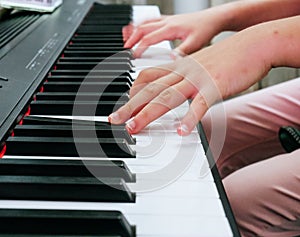 Close-up Finger playing piano keyboard