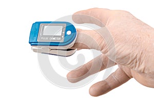 Close up Finger with Pulse Oximeter Measurement. Reduced oxygenation is an emergency sign of pneumonia, for instance caused by