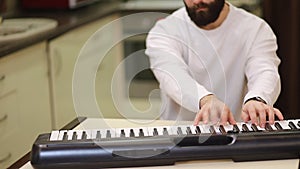 Close up of Fingers, Hands are playing digital electronic Piano Synthesizer.