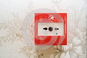 Close up of fire alarm switch in red box on wall