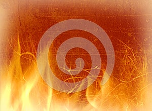 Close-up of fire on a background of an old wall photo