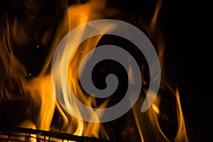 close-up: fire flames in the outdoors grill box for barbeque