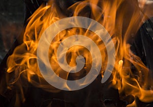 close-up: fire flames in the outdoors grill box for barbeque